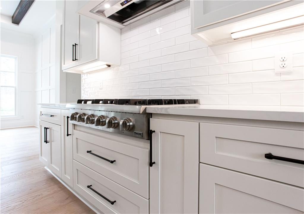 3286 Elwin Ragsdale Way Acworth, GA 30102 - Photo 21 of 51 a kitchen with white cabinets and white appliances