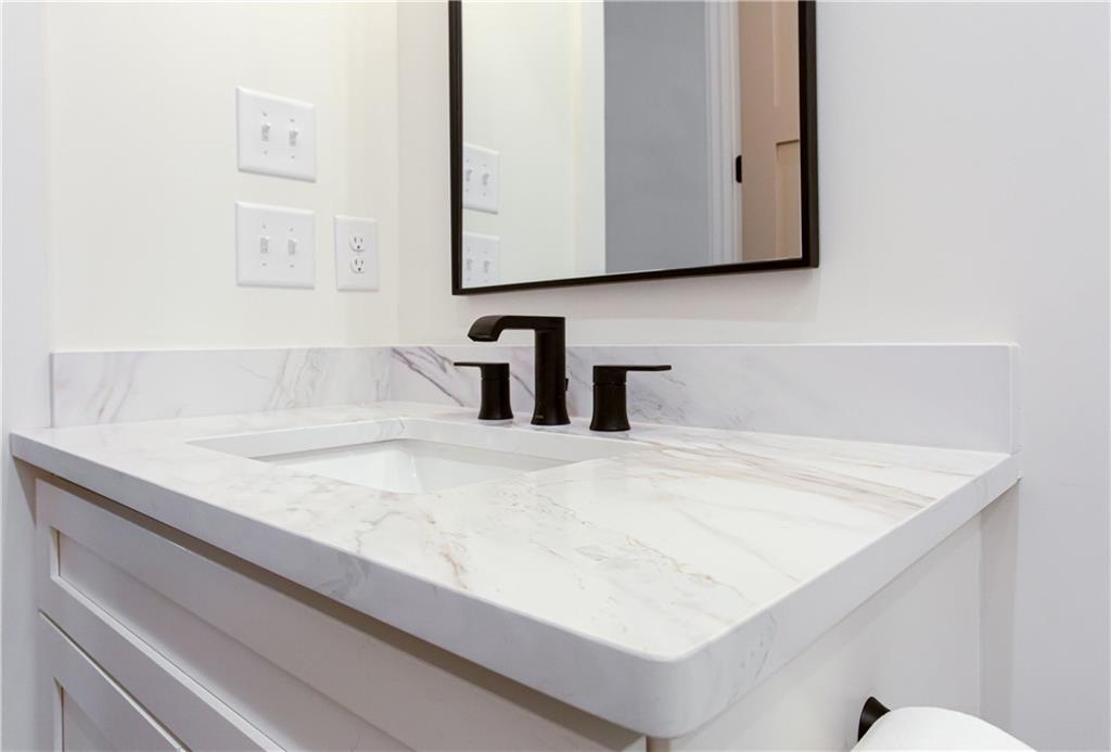 3286 Elwin Ragsdale Way Acworth, GA 30102 - Photo 27 of 51 a bathroom with a sink and a mirror