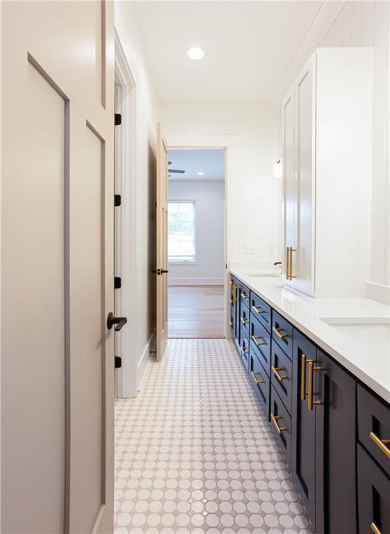 3286 Elwin Ragsdale Way Acworth, GA 30102 - Photo 32 of 51 a bathroom with a sink a mirror and a shower