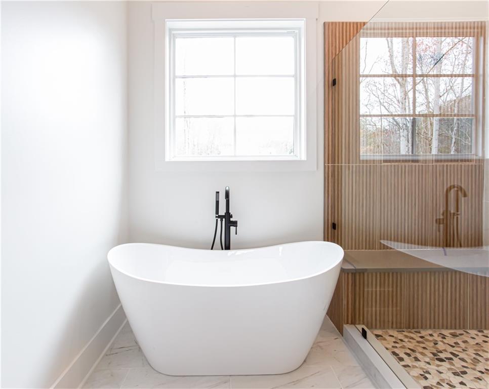 3286 Elwin Ragsdale Way Acworth, GA 30102 - Photo 36 of 51 a white bath tub sitting in a bathroom