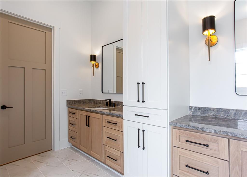 3286 Elwin Ragsdale Way Acworth, GA 30102 - Photo 38 of 51 a bathroom with a granite countertop sink and a mirror