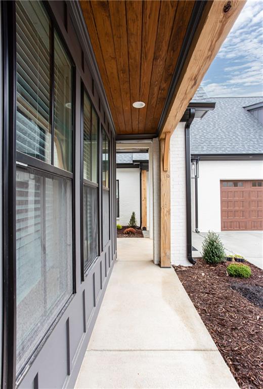 3286 Elwin Ragsdale Way Acworth, GA 30102 - Photo 6 of 51 a view of a hallway with wooden walls and floor to ceiling window and potted plants