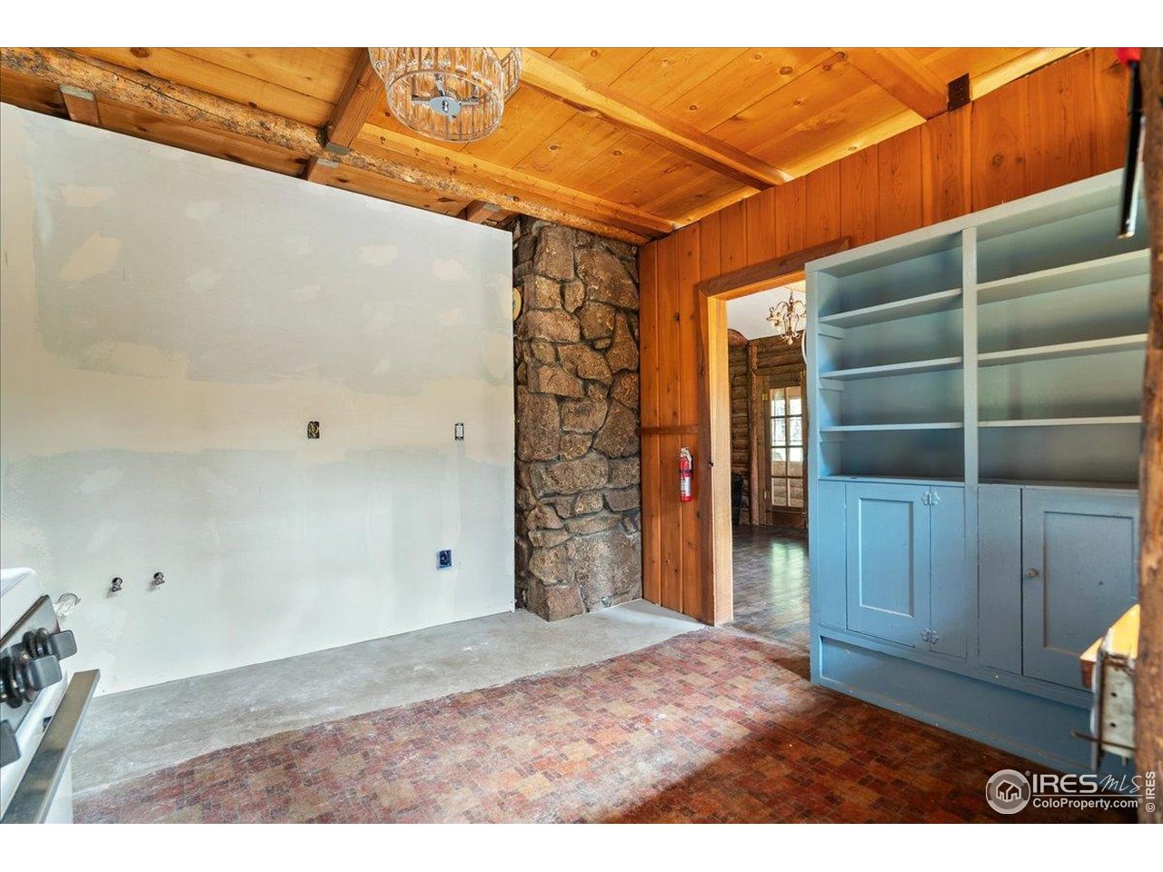 49 Riverside Drive Lyons, CO 80540 - Photo 12 of 32 a view of an empty room with a cabinet and mirror