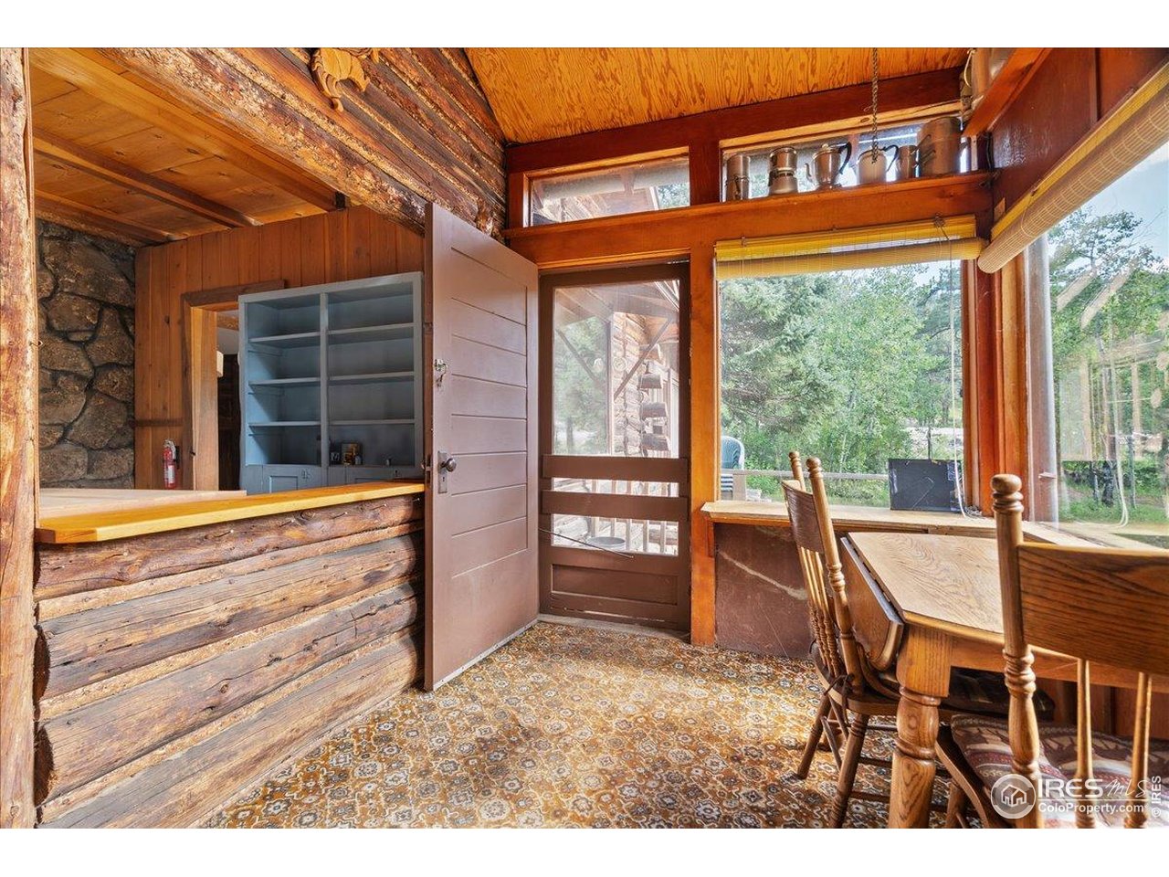 49 Riverside Drive Lyons, CO 80540 - Photo 14 of 32 a backyard of a house with barbeque oven table and chairs