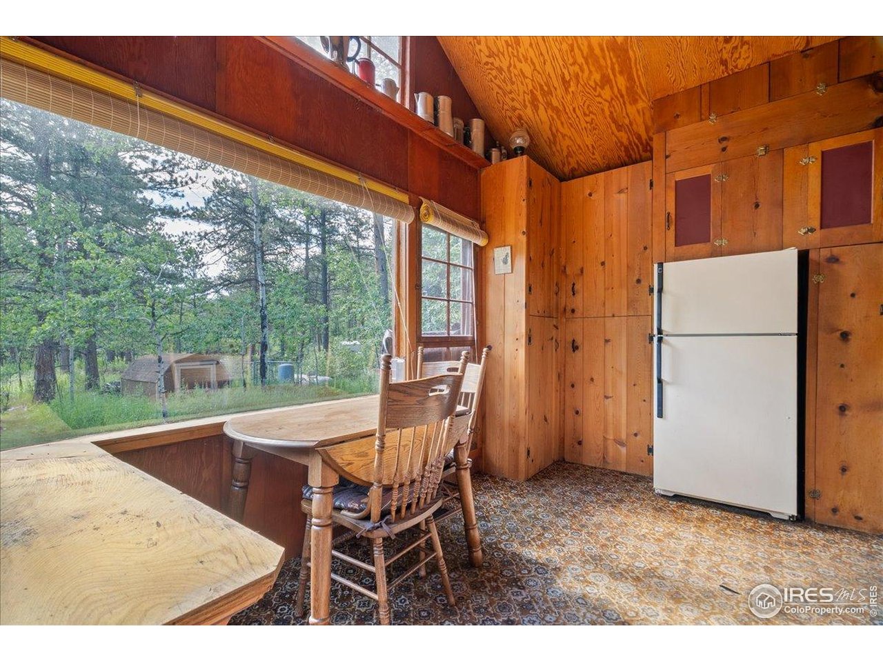 49 Riverside Drive Lyons, CO 80540 - Photo 15 of 32 a patio with yard table and chairs