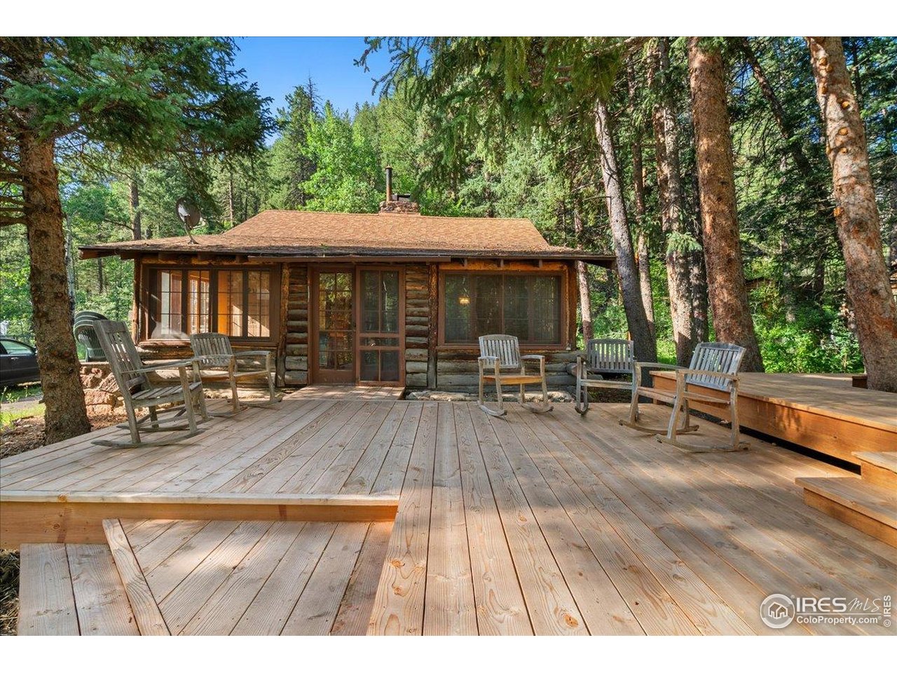 49 Riverside Drive Lyons, CO 80540 - Photo 27 of 32 a view of a patio with chairs and tables