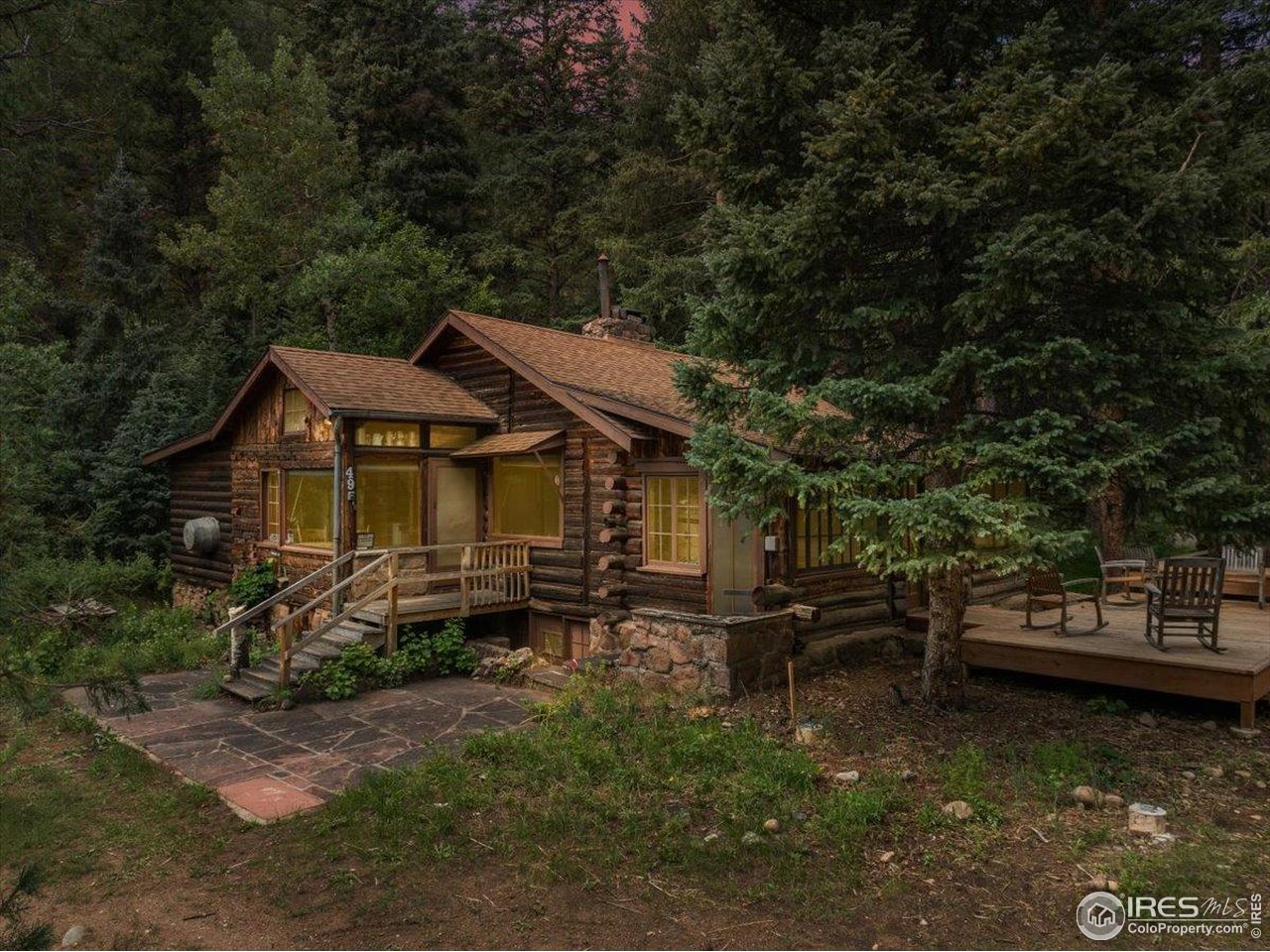 49 Riverside Drive Lyons, CO 80540 - Photo 3 of 32 a backyard of a house with yard barbeque oven and outdoor seating