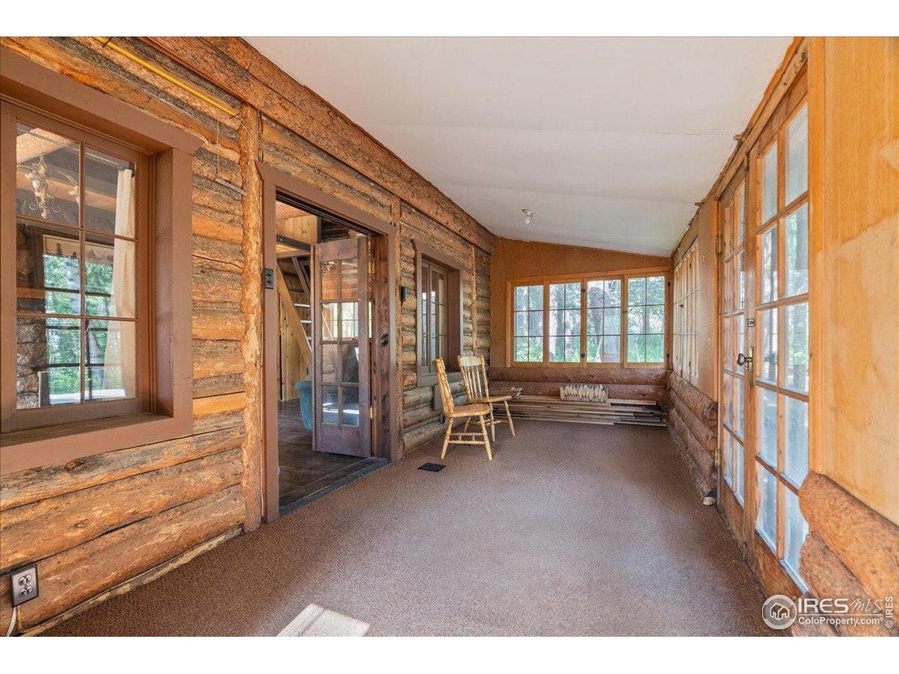 49 Riverside Drive Lyons, CO 80540 - Photo 6 of 32 a view of an entryway with wooden floor