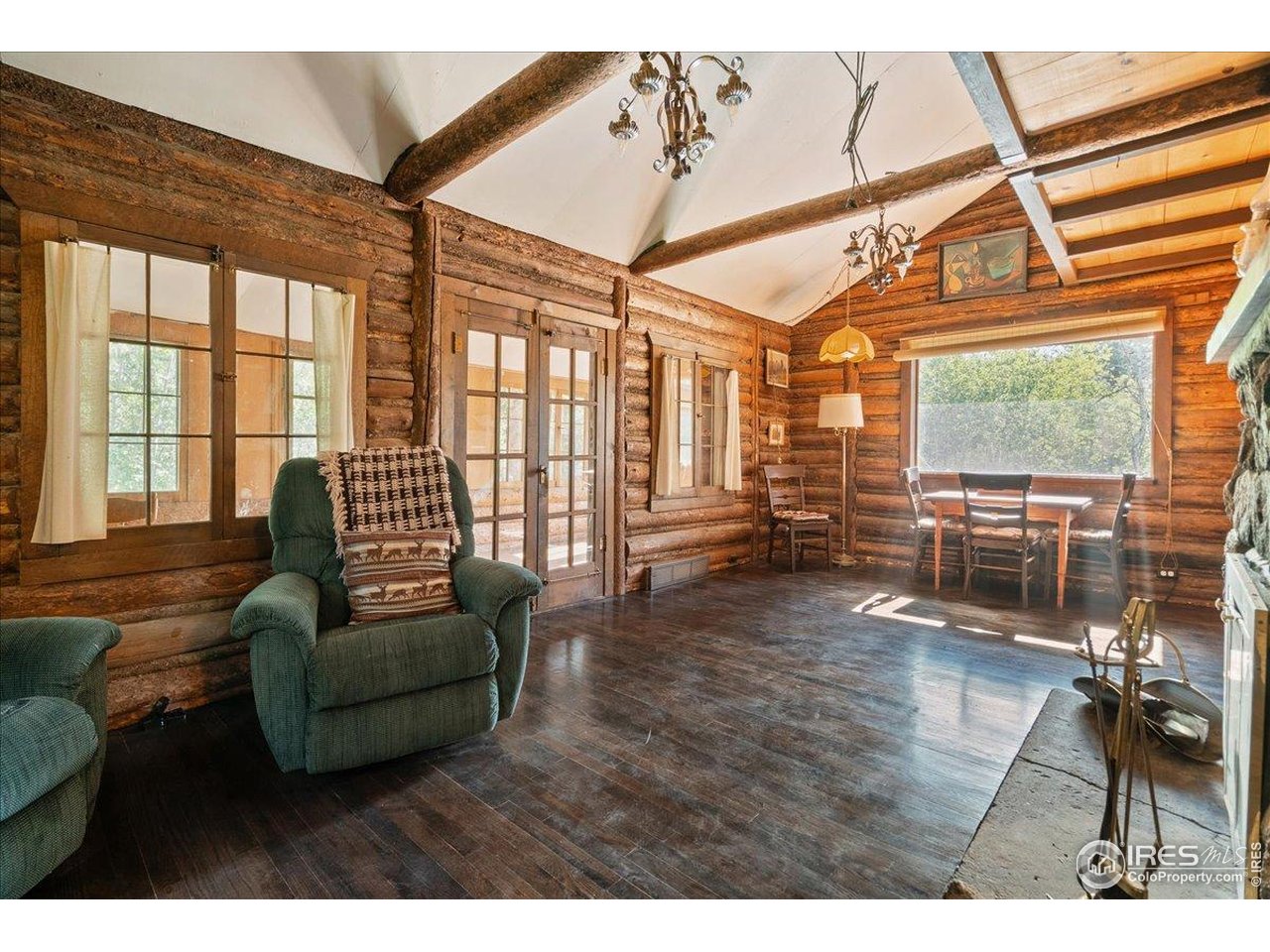 49 Riverside Drive Lyons, CO 80540 - Photo 9 of 32 a living room with furniture and a large window