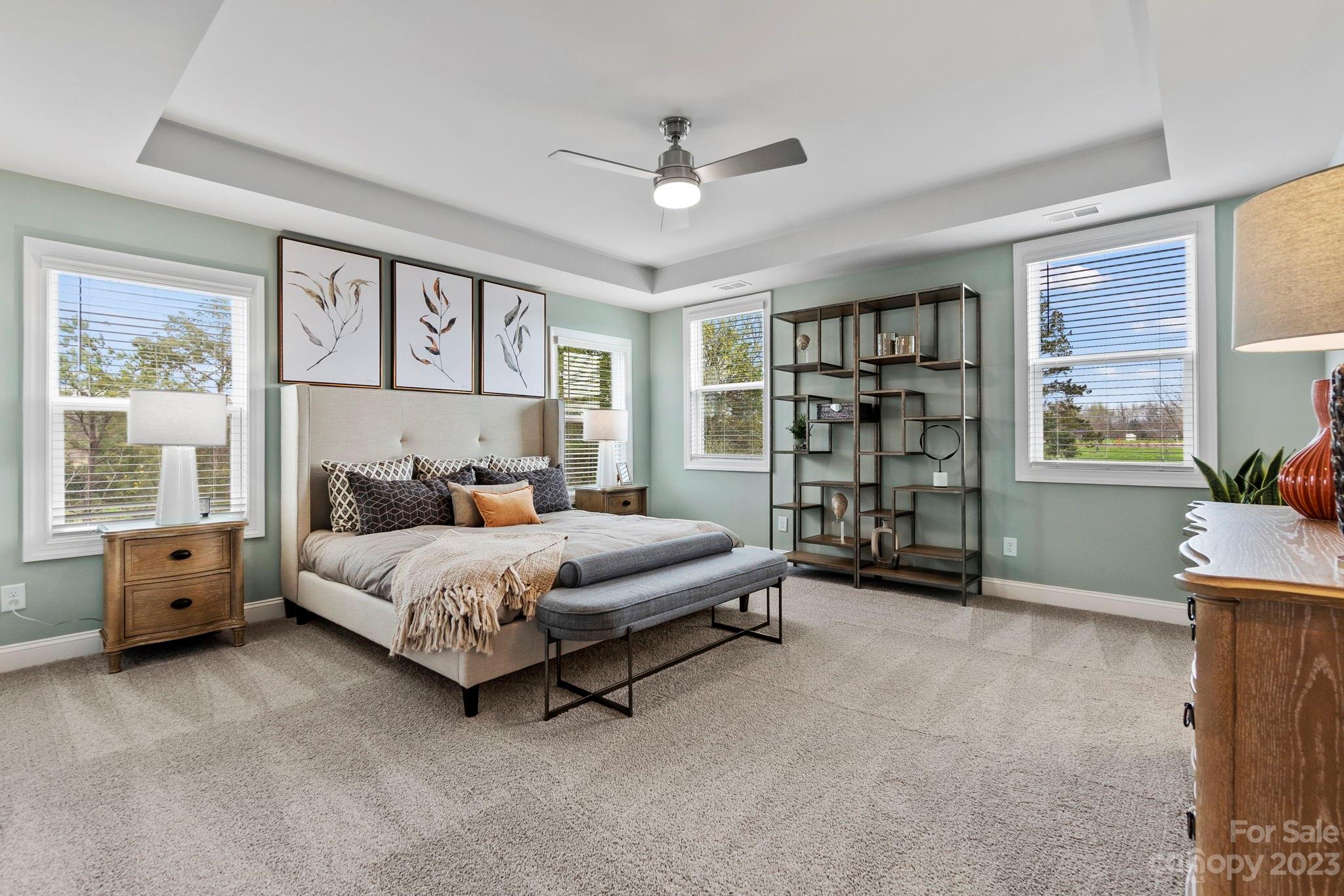 4505 Forsyth Place Fort Mill, SC 29708 - Photo 14 of 23 a spacious bedroom with a bed and a large window