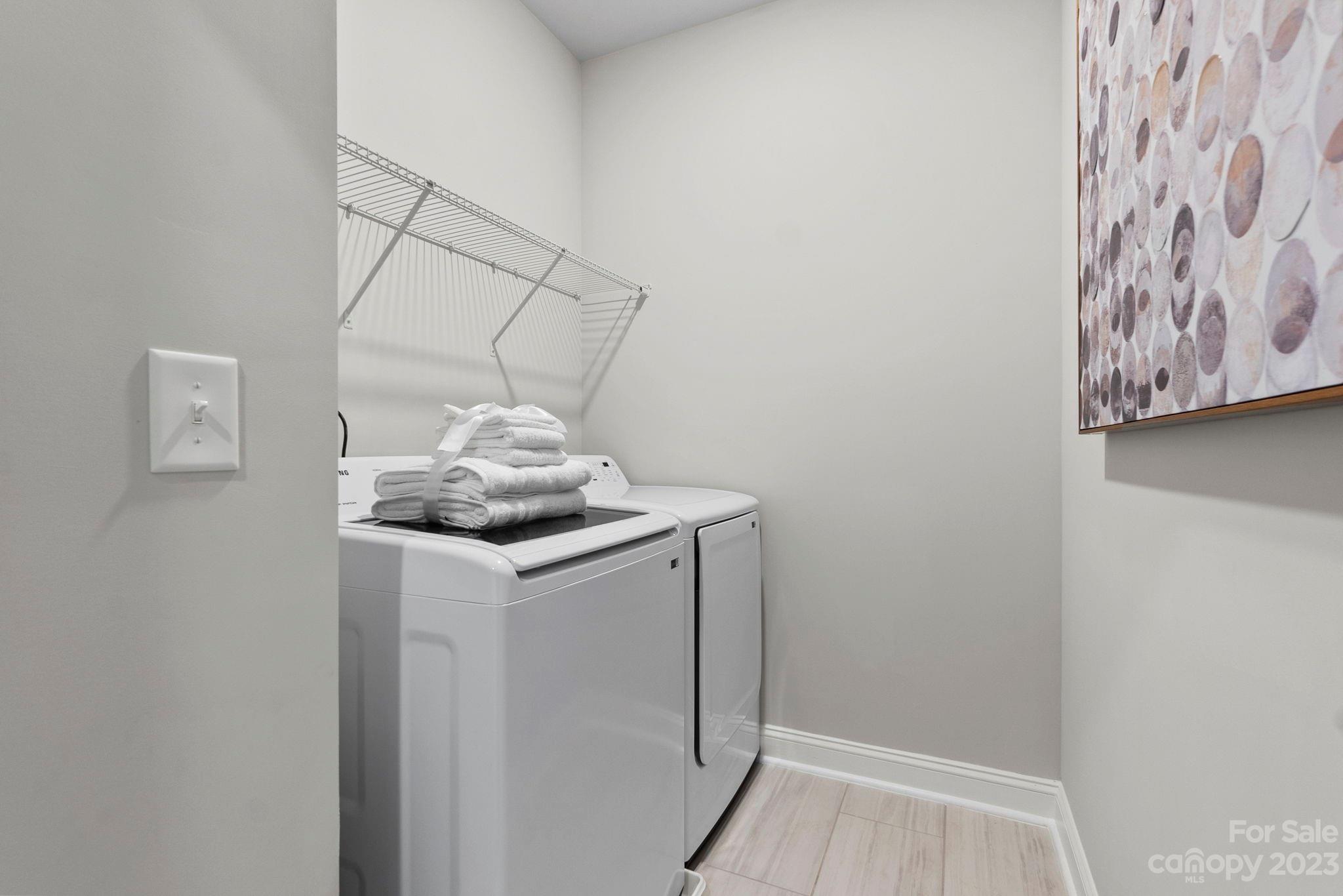 4505 Forsyth Place Fort Mill, SC 29708 - Photo 18 of 23 a utility room with a door dryer and washer