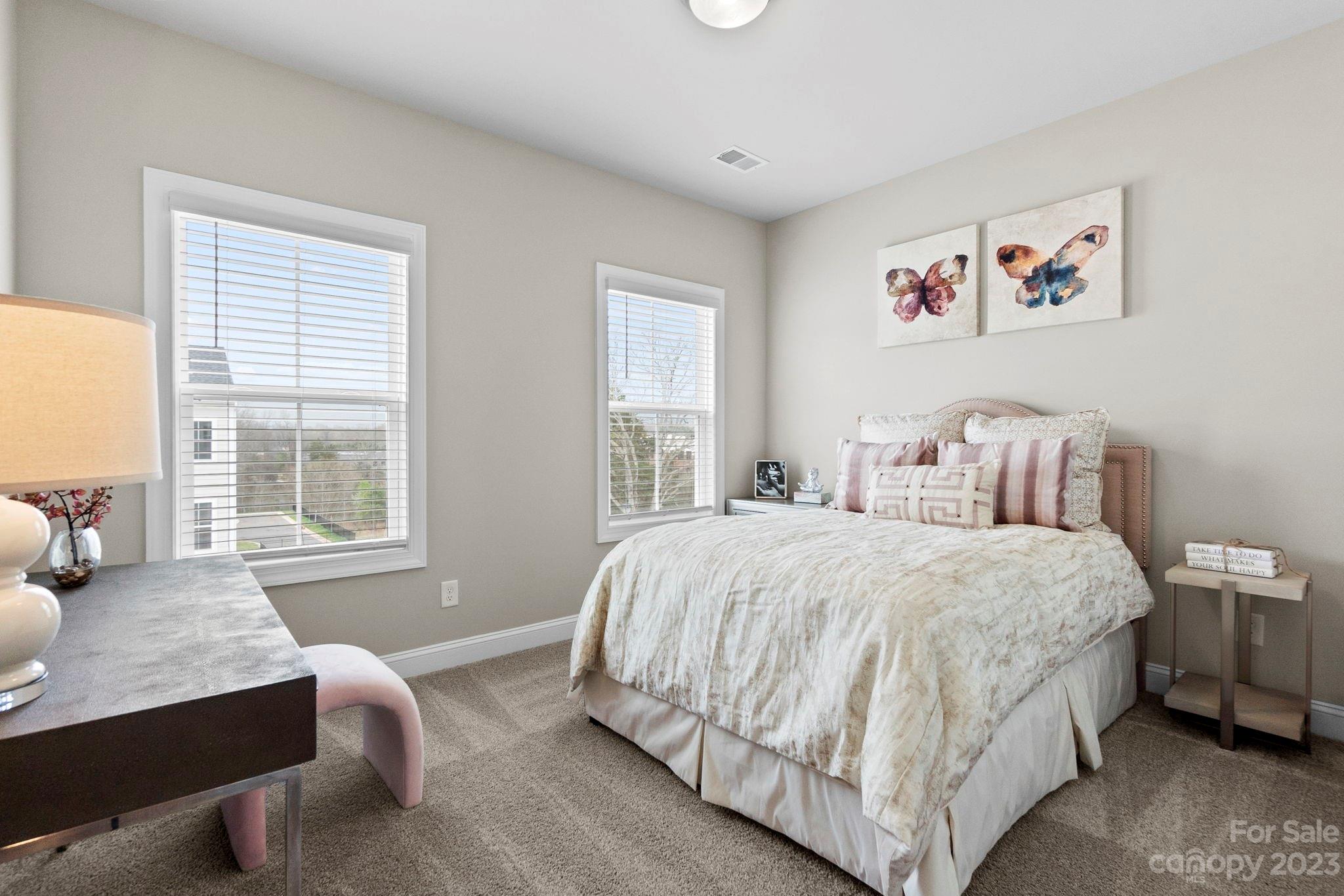 4505 Forsyth Place Fort Mill, SC 29708 - Photo 21 of 23 a bedroom with a bed and a couch