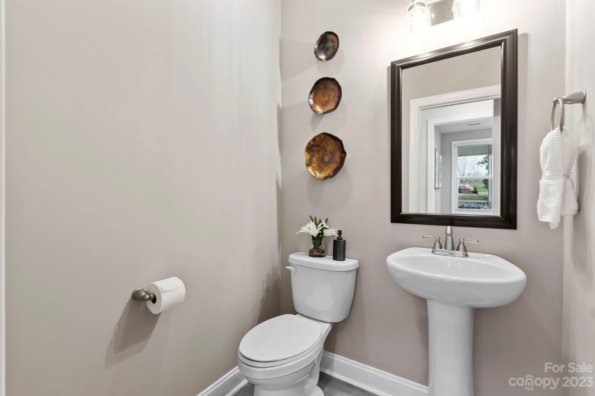 4505 Forsyth Place Fort Mill, SC 29708 - Photo 10 of 23 a bathroom with a sink mirror and toilet