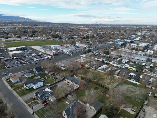 8475 South State Street Sandy, UT 84070 - Photo 15 of 31 Aerial overview of property's location with a mountainous background and nearby suburban area