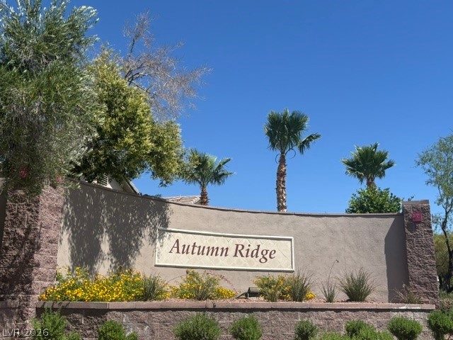 10959 Pumpkin Ridge Avenue Las Vegas, NV 89135 - Photo 41 of 51 Enter the Autumn Ridge community framed by lush landscaping and palm trees.