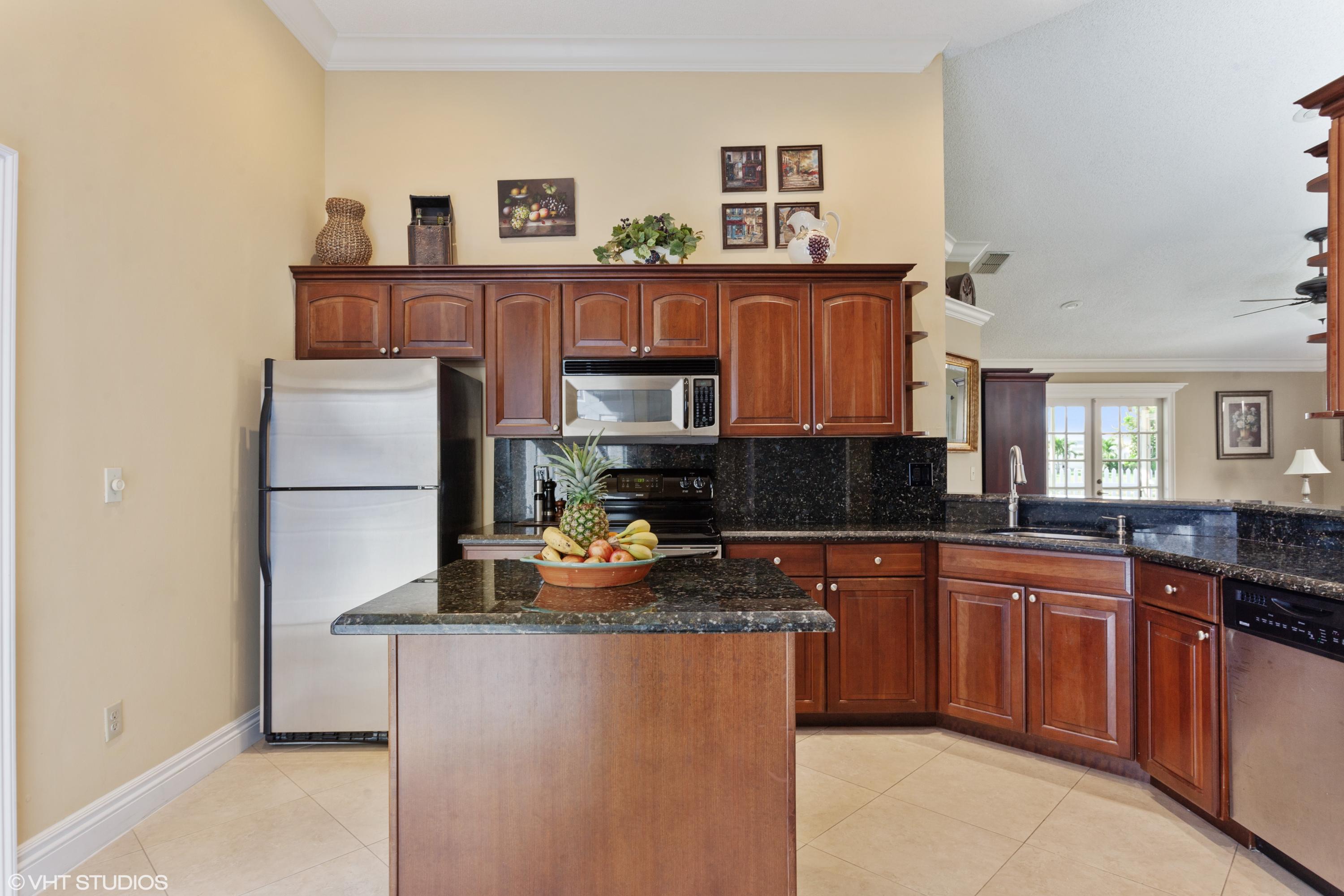 8563 Dynasty Drive Boca Raton, FL 33433 - Photo 4 of 15 04_8563DynastyDr_177002_Kitchen_HiRes