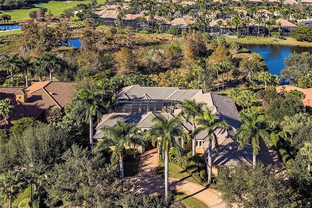 14919 Celle Way Naples, FL 34110 - Photo 19 of 42 an aerial view of a house with a yard and lake view