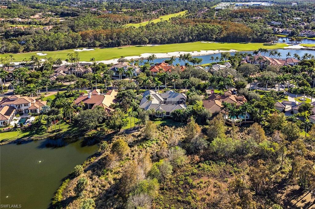 14919 Celle Way Naples, FL 34110 - Photo 21 of 42 a view of a lake with a city