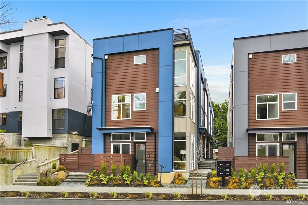 2408 Dexter Avenue North, Unit B Seattle, WA 98109 - Photo 2 of 11 a front view of a building with street view