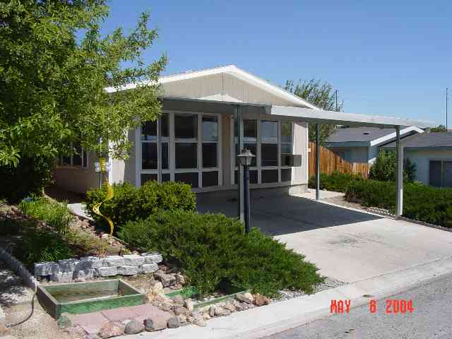 2157 Barberry Way, Unit 57 Reno, NV 89512 - Photo 1 of 7 a front view of a house with garden