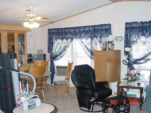 2157 Barberry Way, Unit 57 Reno, NV 89512 - Photo 2 of 7 a living room with furniture and a chandelier
