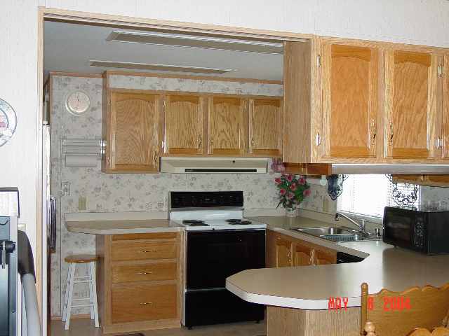 2157 Barberry Way, Unit 57 Reno, NV 89512 - Photo 3 of 7 a kitchen with stainless steel appliances granite countertop a sink and cabinets