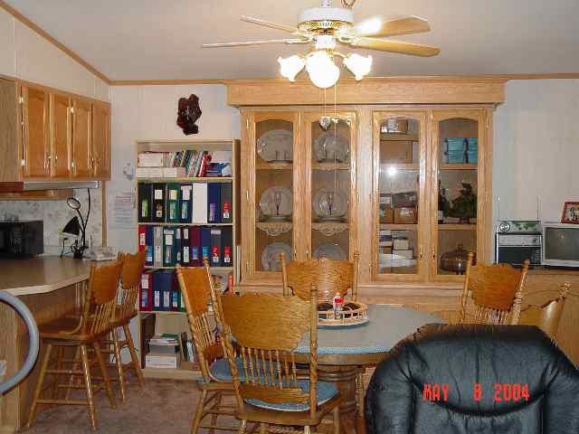 2157 Barberry Way, Unit 57 Reno, NV 89512 - Photo 4 of 7 a view of a dining room with furniture a chandelier and wooden floor