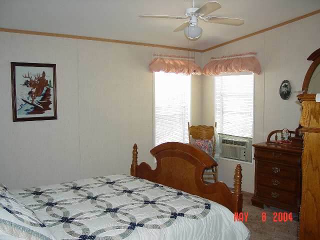 2157 Barberry Way, Unit 57 Reno, NV 89512 - Photo 6 of 7 a bedroom with a bed and wooden floor