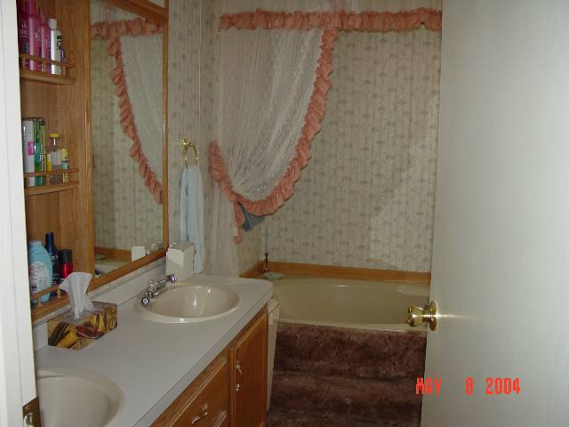 2157 Barberry Way, Unit 57 Reno, NV 89512 - Photo 7 of 7 a bathroom with a sink and a mirror