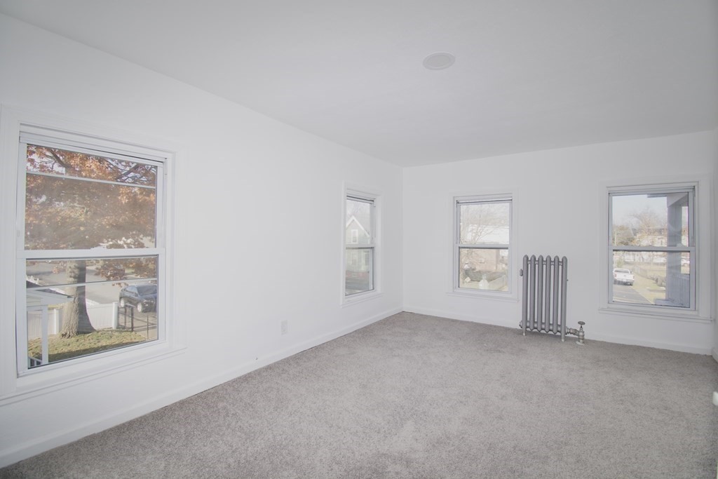 79 Quincy Street Springfield, MA 01109 - Photo 16 of 27 an empty room with windows
