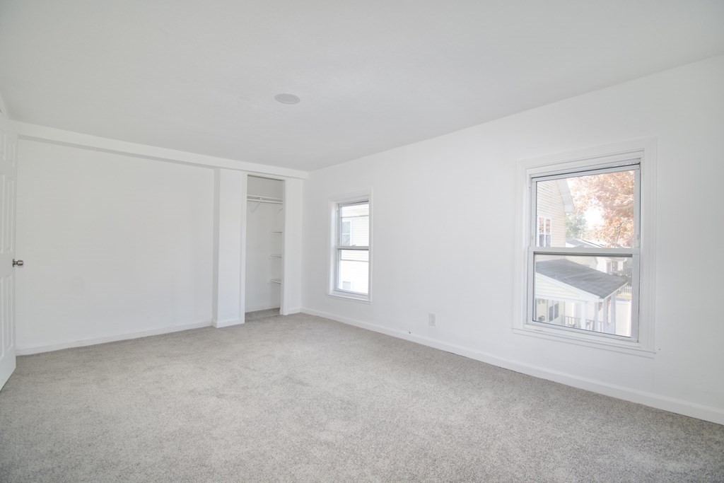 79 Quincy Street Springfield, MA 01109 - Photo 17 of 27 an empty room with windows