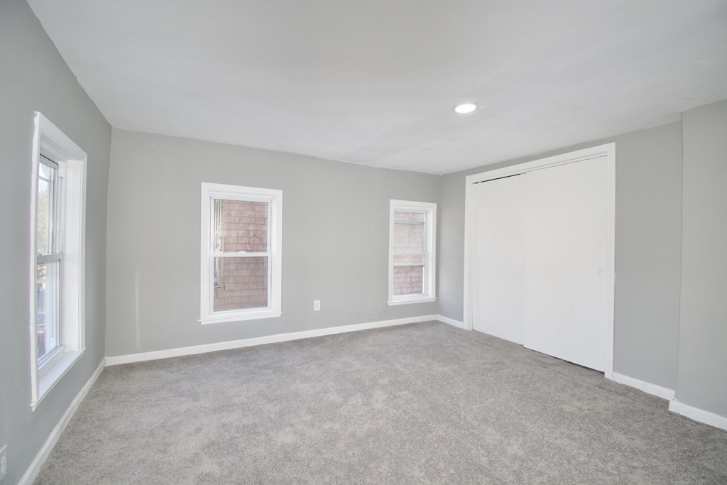 79 Quincy Street Springfield, MA 01109 - Photo 18 of 27 an empty room with windows