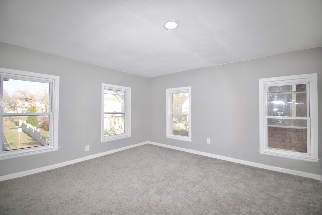 79 Quincy Street Springfield, MA 01109 - Photo 19 of 27 a view of an empty room with a window