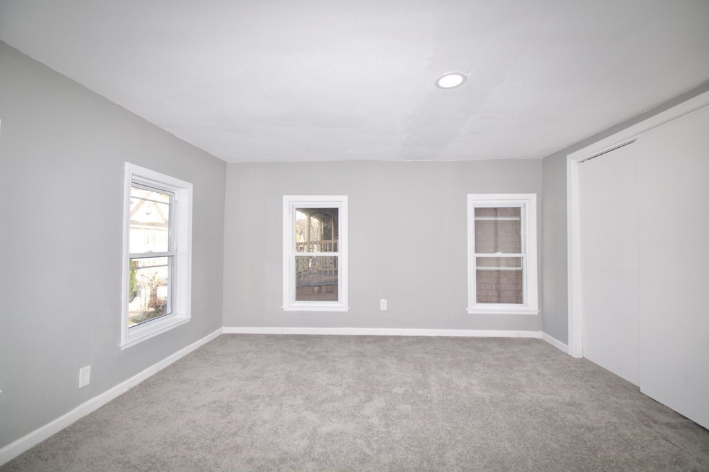 79 Quincy Street Springfield, MA 01109 - Photo 20 of 27 an empty room with windows