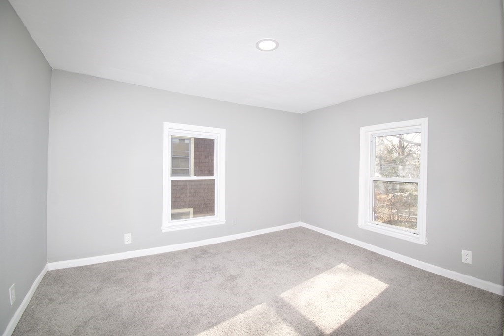 79 Quincy Street Springfield, MA 01109 - Photo 23 of 27 an empty room with a window