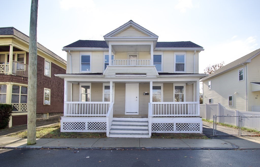 79 Quincy Street Springfield, MA 01109 - Photo 3 of 27 a front view of a house with a garden