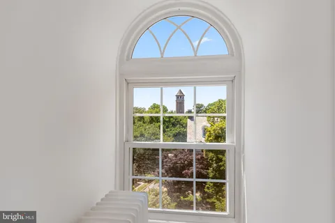 a view of room with wooden floor table and window