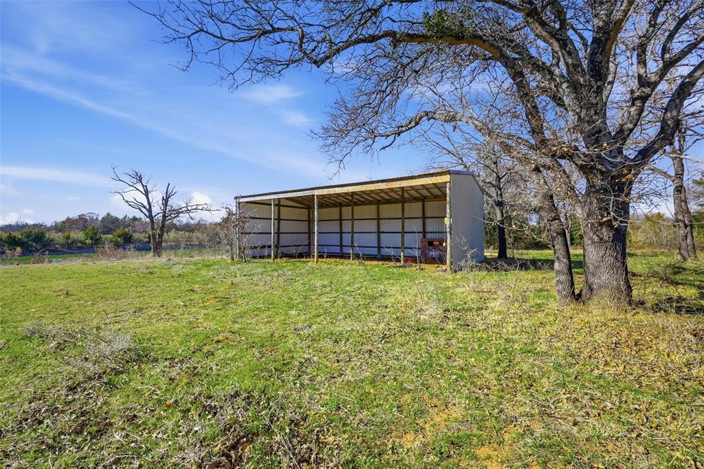 1619 County 156 Road Whitesboro, TX 76273 - Photo 10 of 17 a view of a house with a backyard