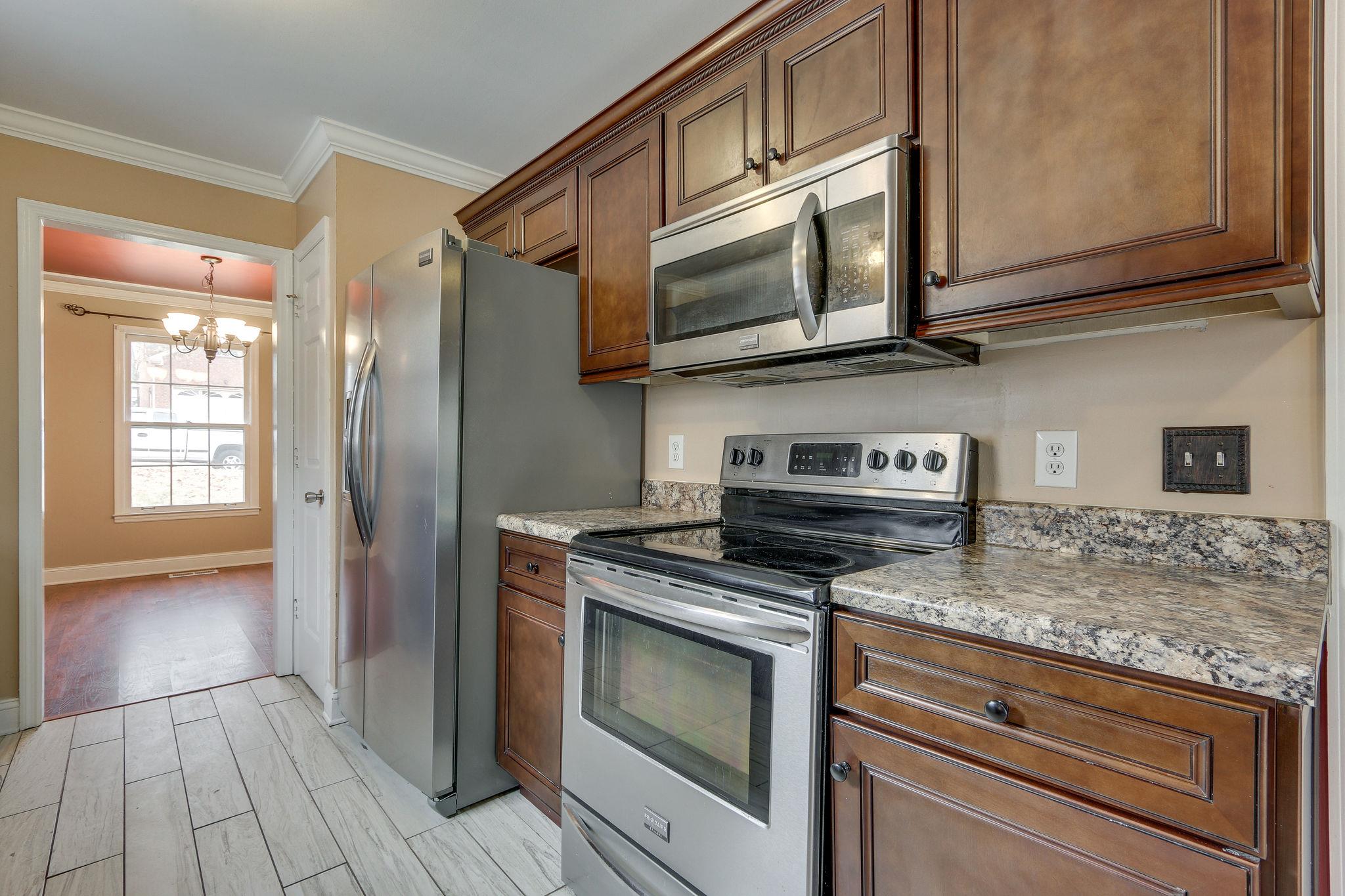 1056 Fitzpatrick Road Nashville, TN 37214 - Photo 12 of 28 Newer appliances including dishwasher, microwave, stove and refrigerator – washer and dryer remain as well
