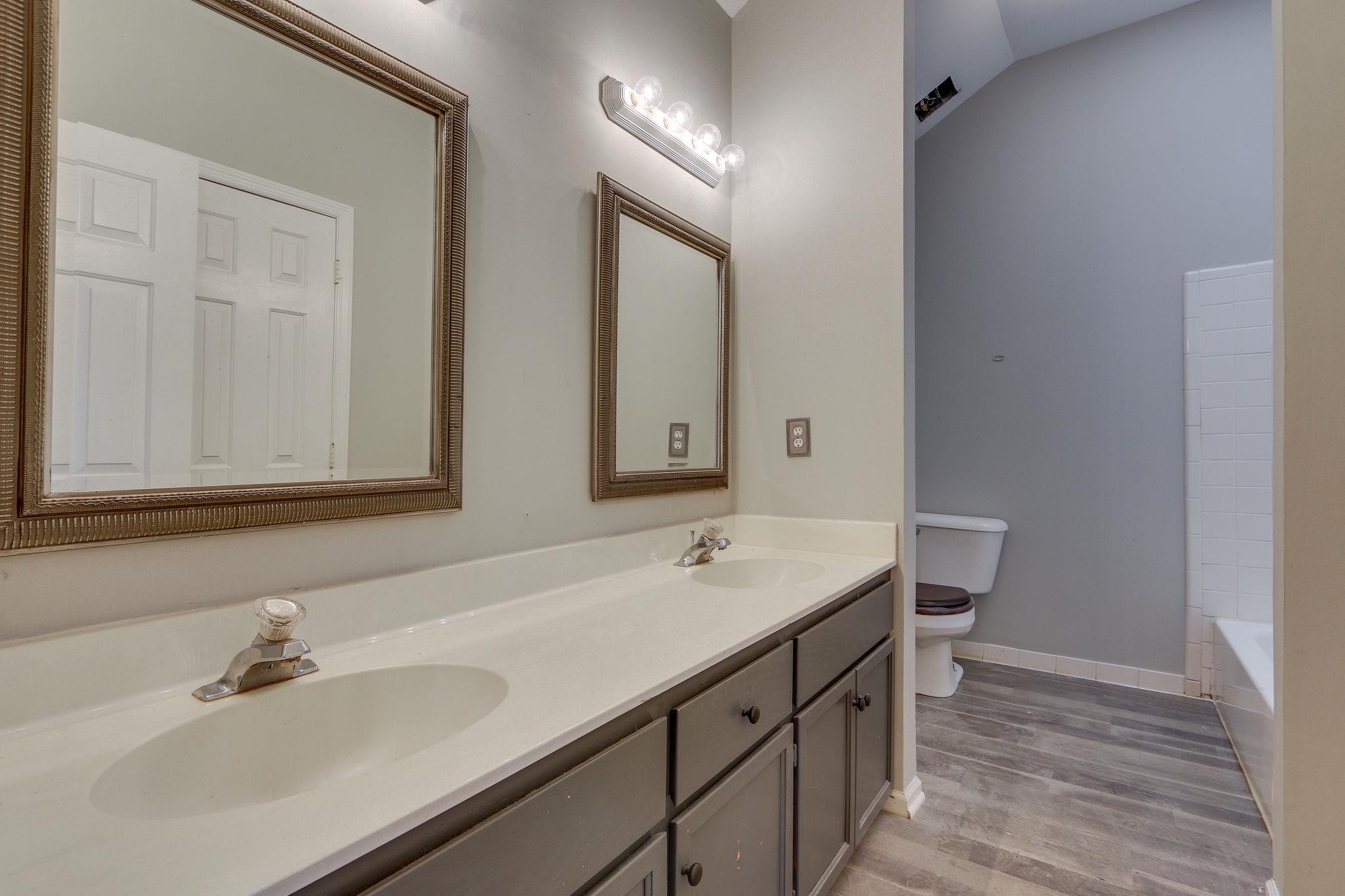 1056 Fitzpatrick Road Nashville, TN 37214 - Photo 16 of 28 Master bath with double vanities and updated flooring