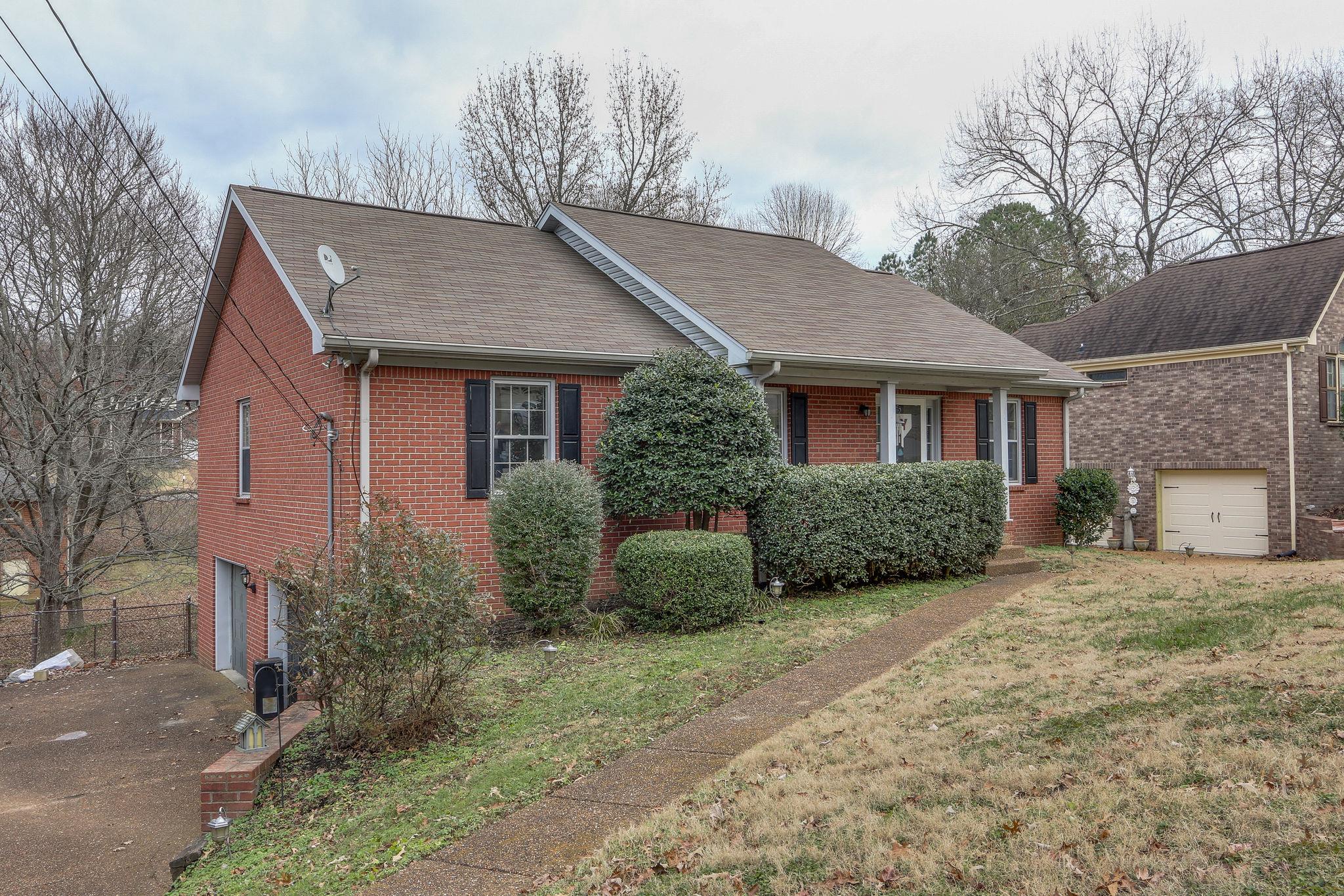 1056 Fitzpatrick Road Nashville, TN 37214 - Photo 2 of 28 Aggregate drive and sidewalk with two-car basement garage
