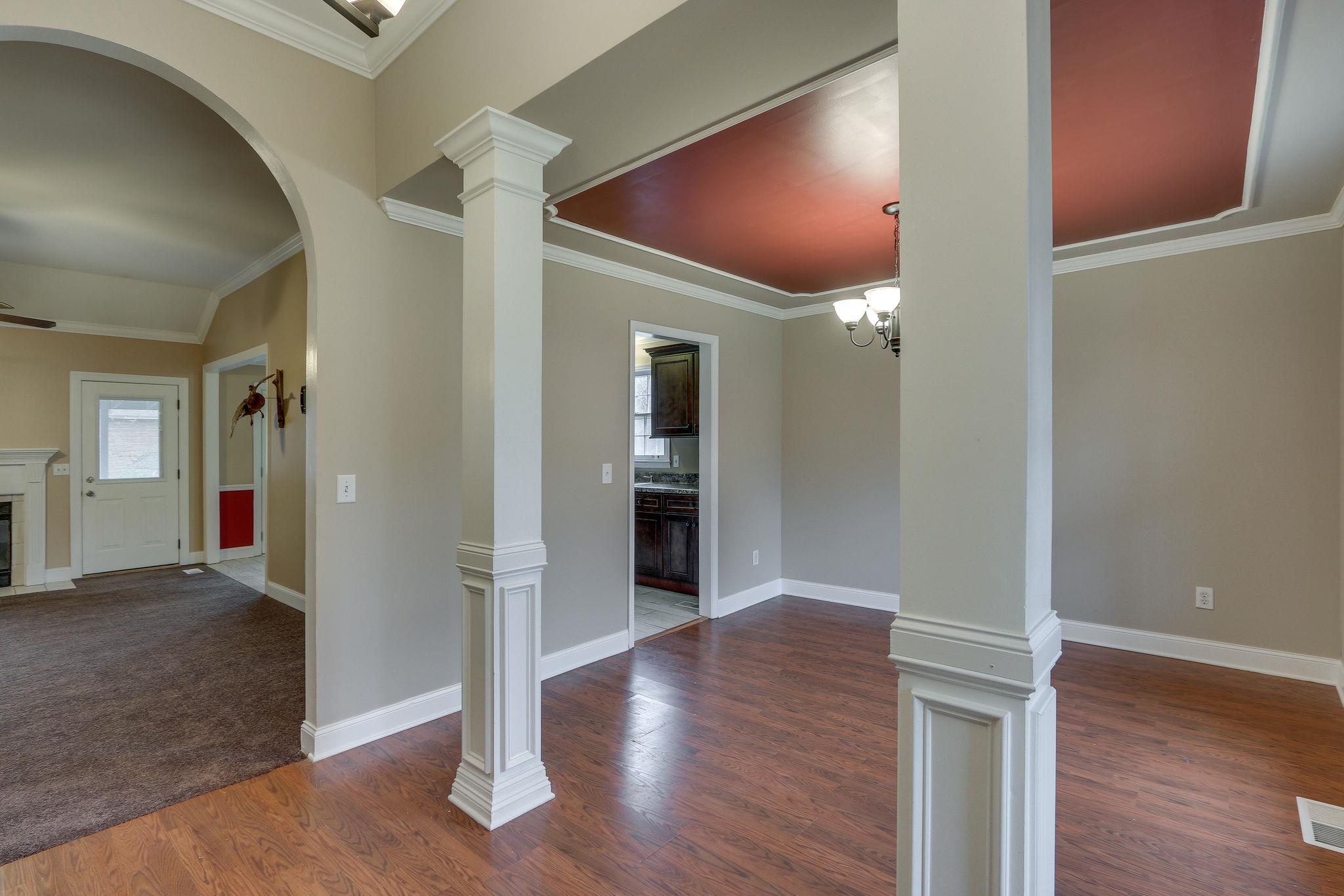 1056 Fitzpatrick Road Nashville, TN 37214 - Photo 4 of 28 Entering home in foyer with access to formal dining with columns and arched opening to living room