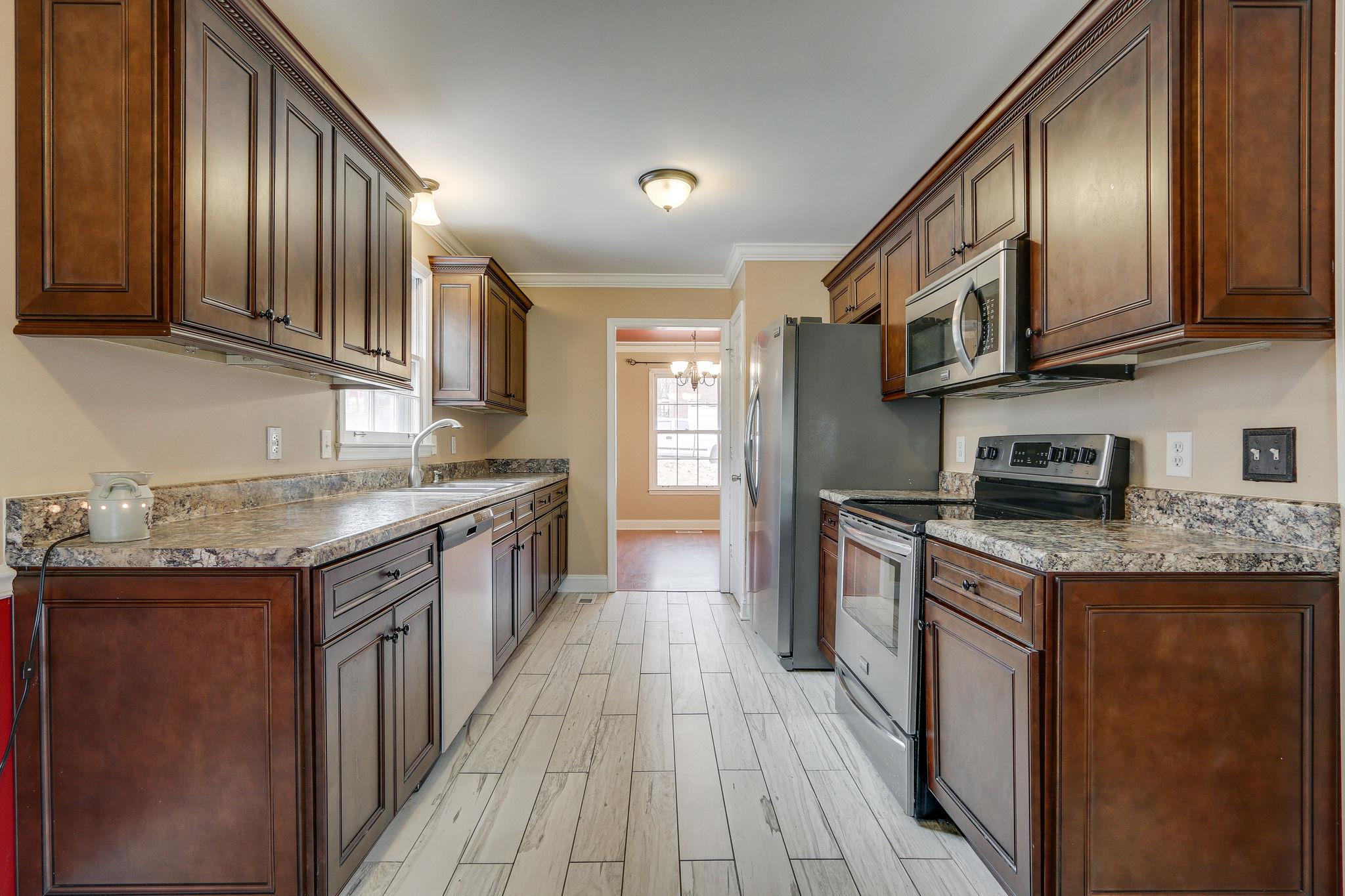 1056 Fitzpatrick Road Nashville, TN 37214 - Photo 10 of 28 Renovated kitchen with newer cabinets, granite tops and stainless appliances