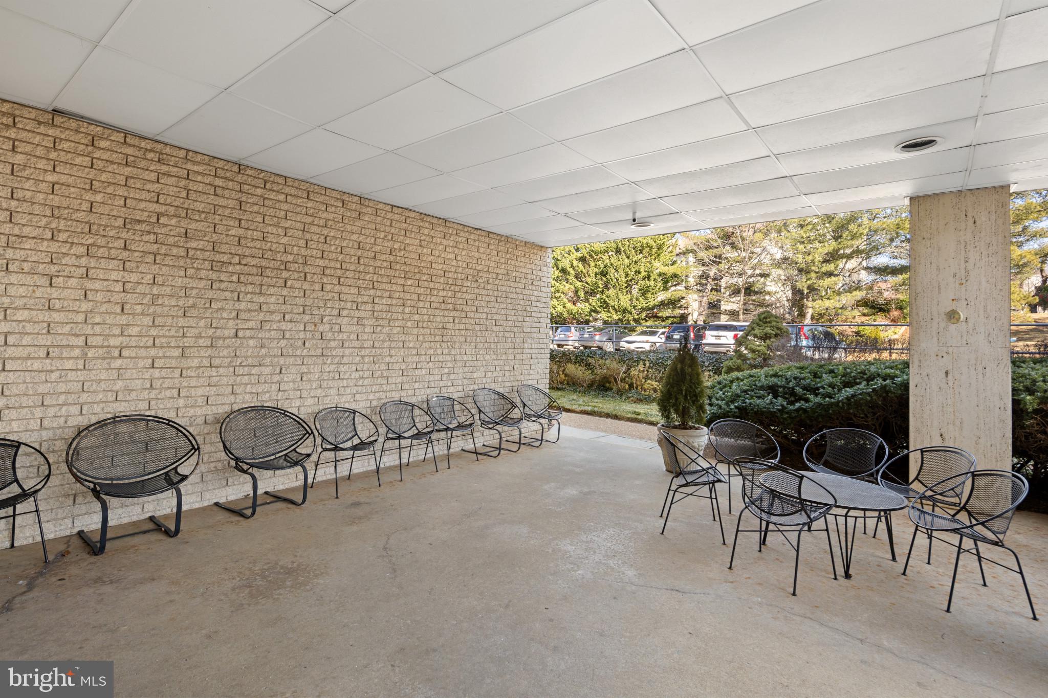 4401 Roland Avenue, Unit 310 Baltimore, MD 21210 - Photo 3 of 24 a view of a chairs and table in patio