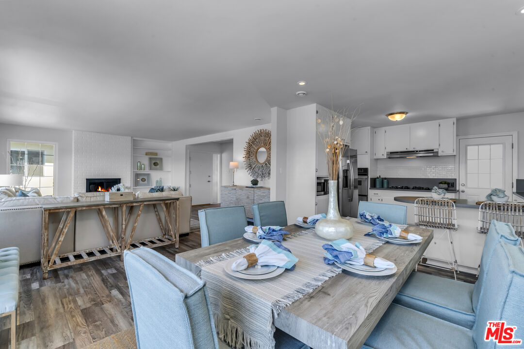 8330 Zitola Terrace Playa del Rey, CA 90293 - Photo 12 of 48 a kitchen with a table chairs stove and cabinets