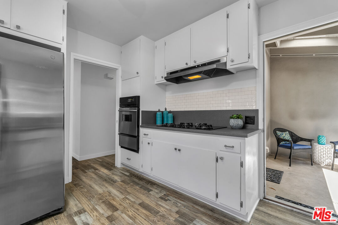 8330 Zitola Terrace Playa del Rey, CA 90293 - Photo 16 of 48 a kitchen with stainless steel appliances white cabinets and a refrigerator