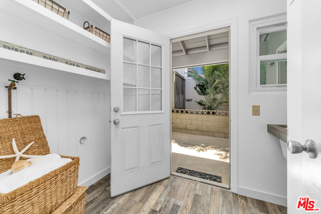 8330 Zitola Terrace Playa del Rey, CA 90293 - Photo 19 of 48 a view of an empty room with wooden floor and a window