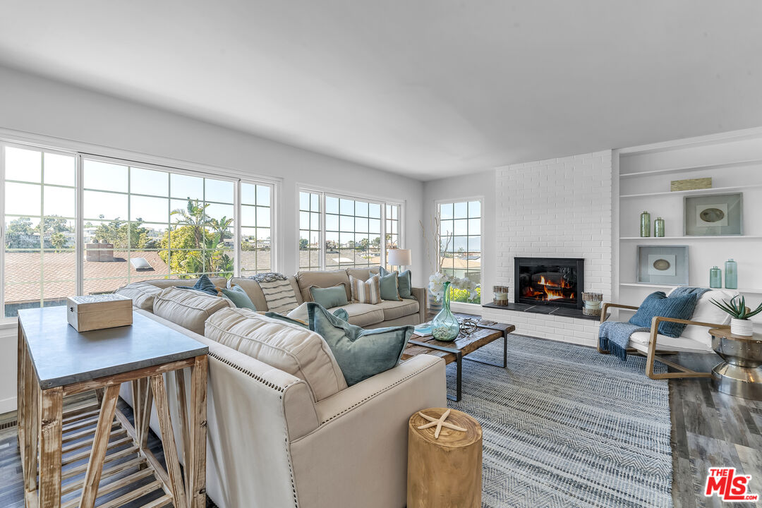 8330 Zitola Terrace Playa del Rey, CA 90293 - Photo 2 of 48 a living room with furniture fireplace and a large window