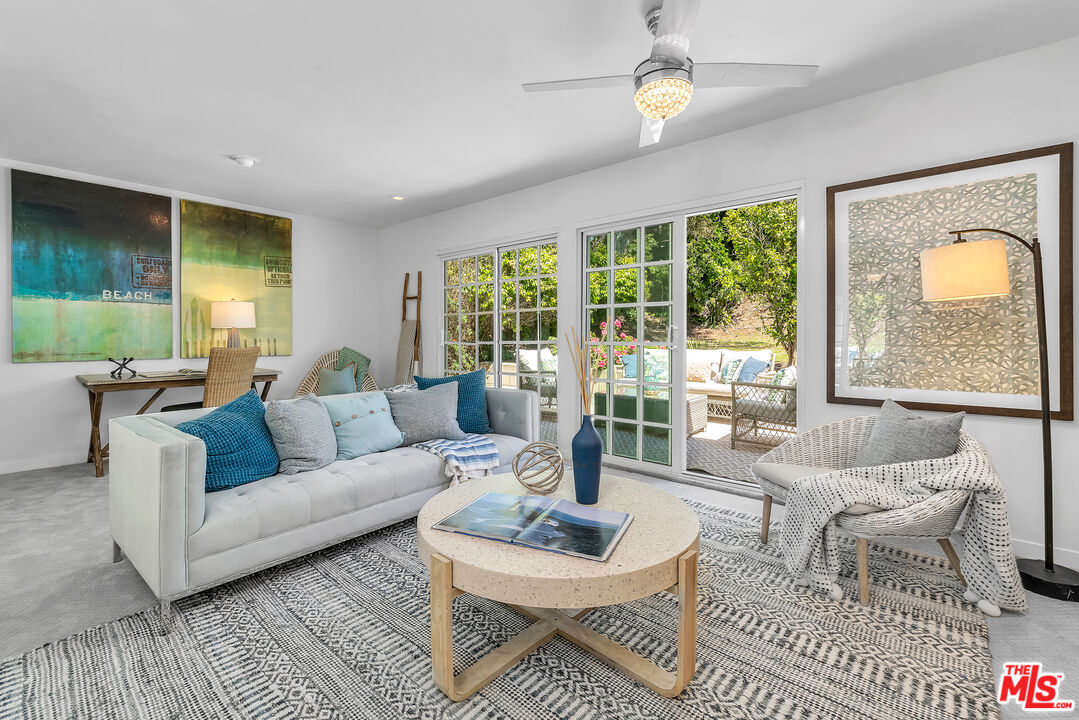 8330 Zitola Terrace Playa del Rey, CA 90293 - Photo 32 of 48 a living room with fireplace furniture and a large window