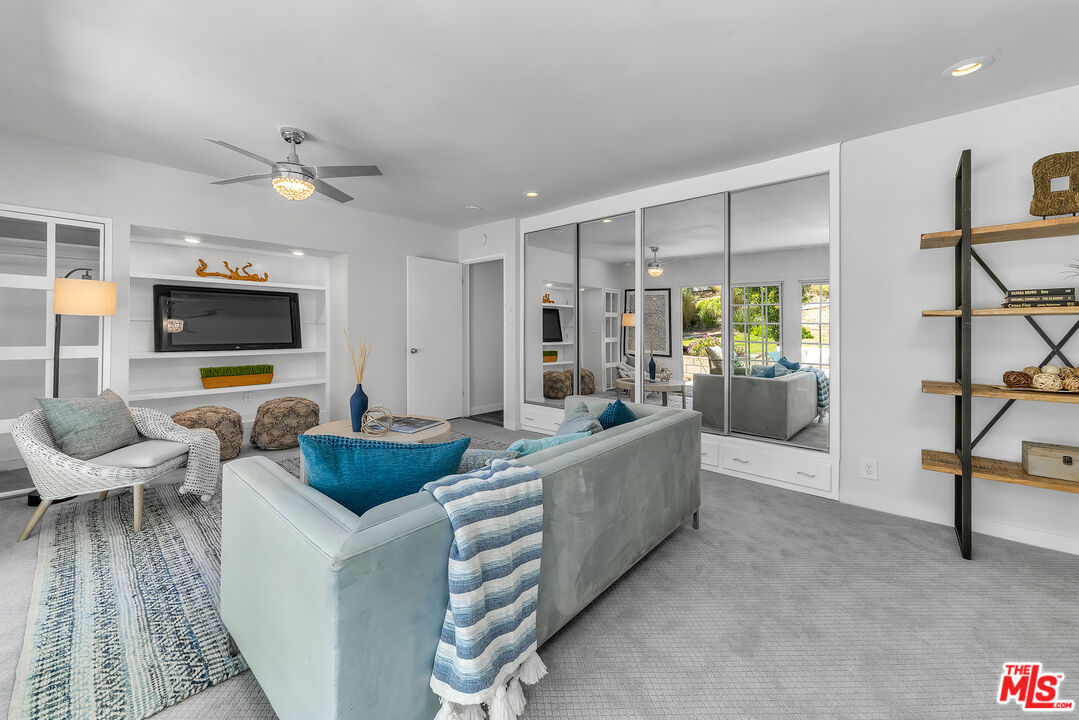 8330 Zitola Terrace Playa del Rey, CA 90293 - Photo 33 of 48 a living room with furniture and a flat screen tv